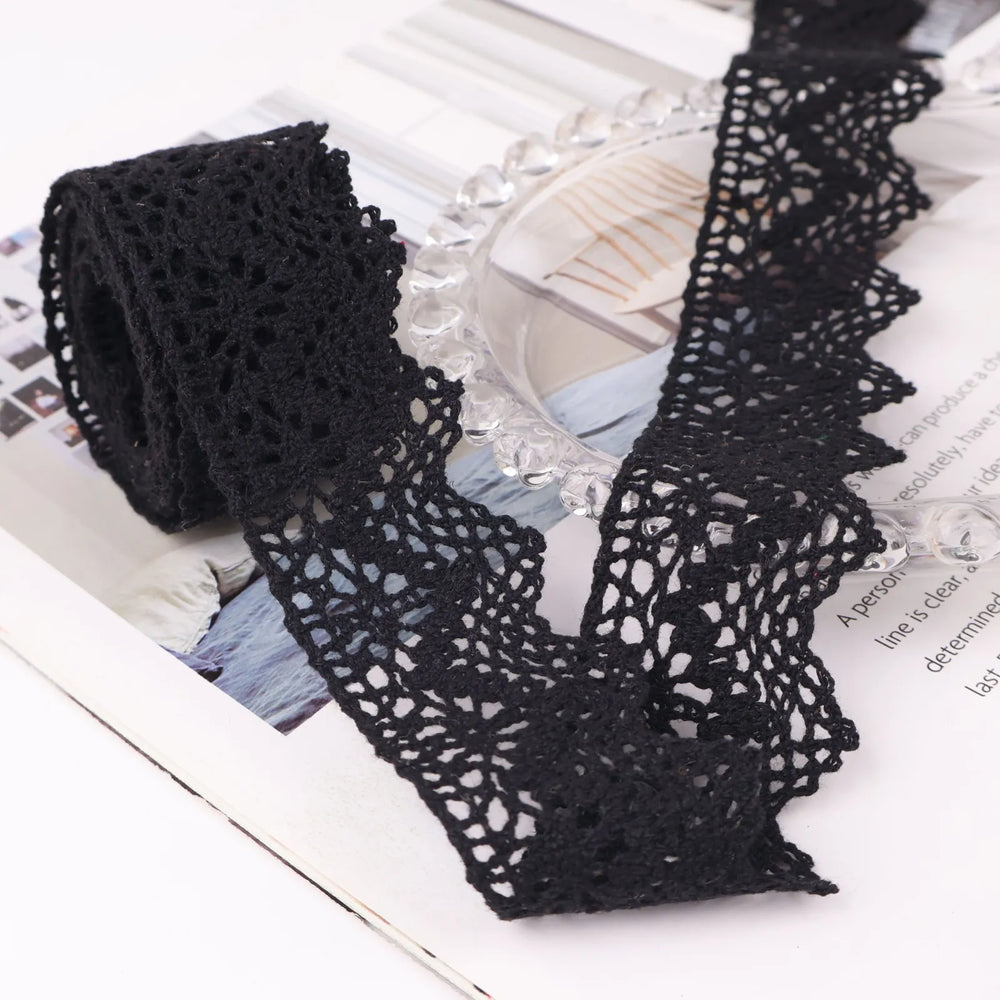 IDONGCAI cluny crochet lace trim in black showing 1.5 inch wide cotton floral lace in a 2 yard length