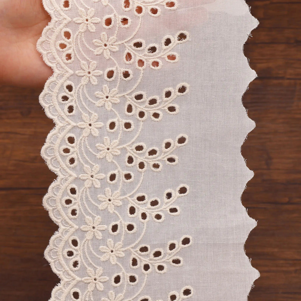 Close-up of cotton eyelet lace scalloped edge texture for DIY decoration