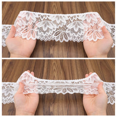 Stretch demonstration of IDONGCAI Floral Elastic Lace Trim showing elasticity and floral scalloped edge