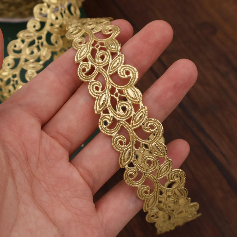 Close-up of Golden Ribbon gold lace trim showing the pattern and texture