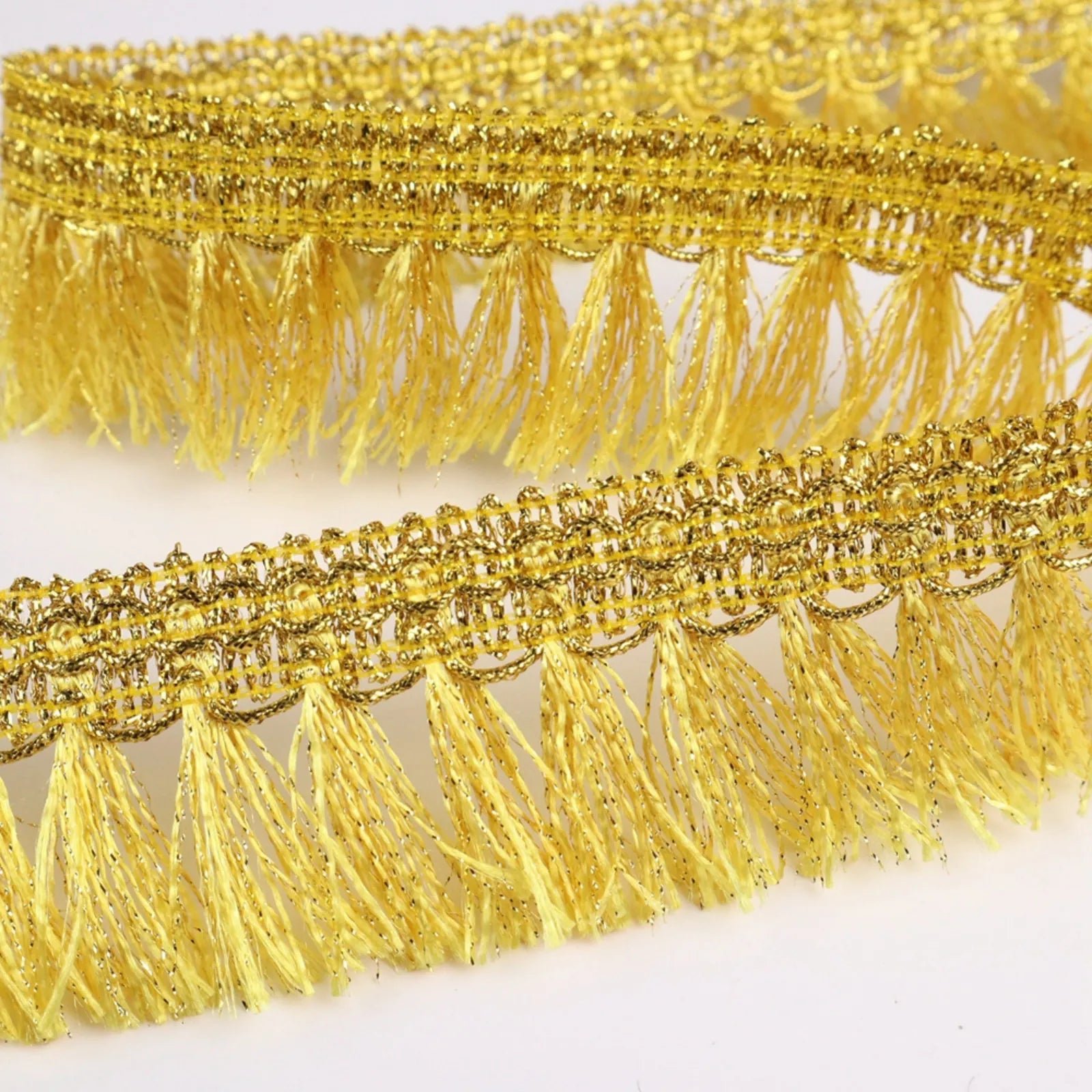 Close-up of Golden Tassel Fringe Trim Texture and Tassel Chainette Detail