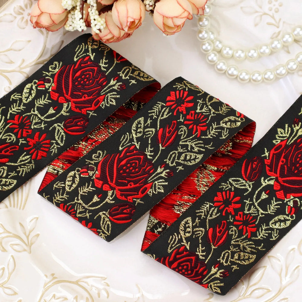 Front view of black and red floral embroidered jacquard ribbon texture