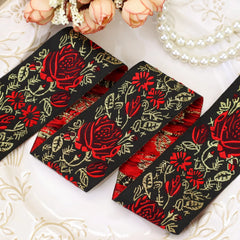 Front view of black and red floral embroidered jacquard ribbon texture