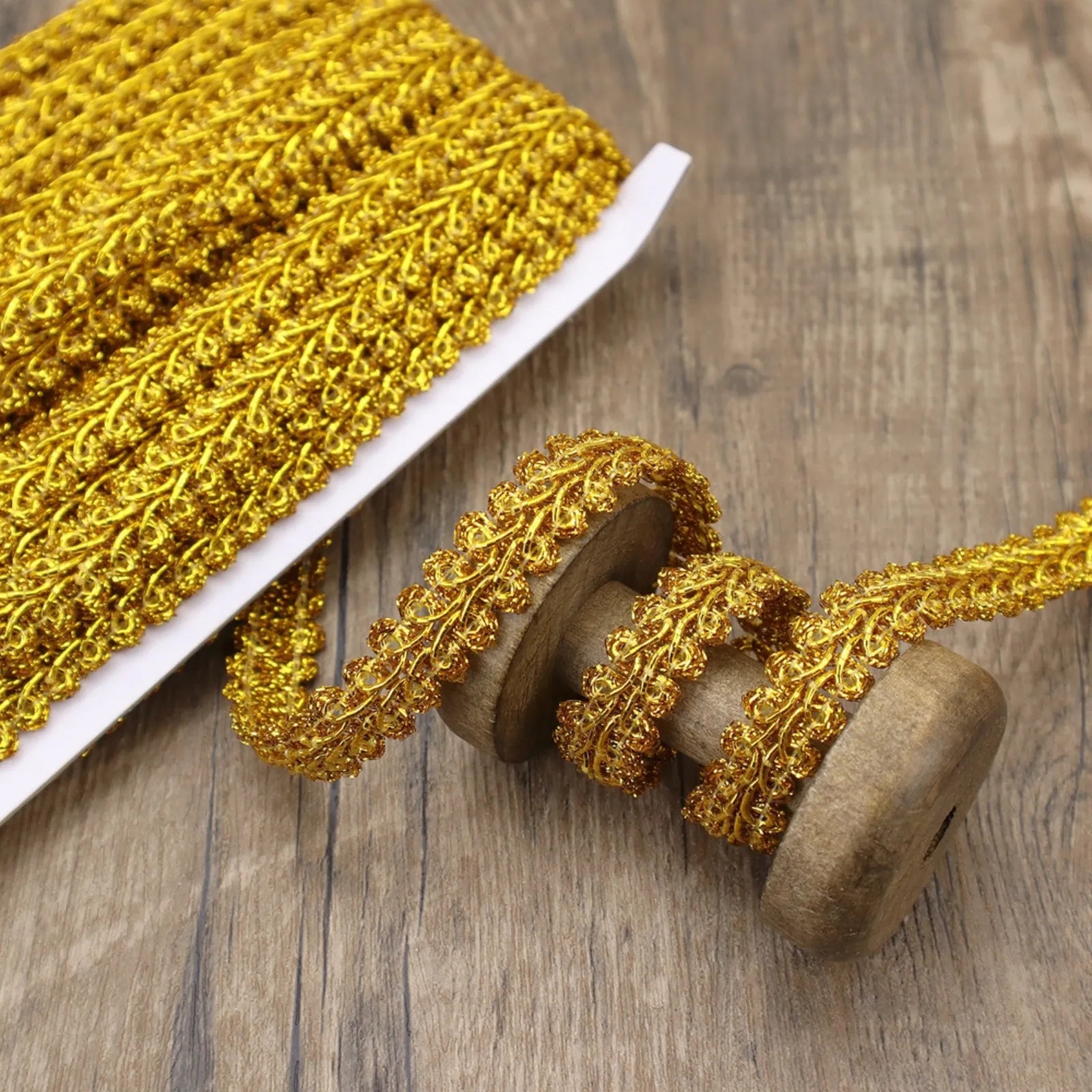 Close-up of the golden Gimp Braid Trim showing its wavy texture, perfect for DIY crafts.