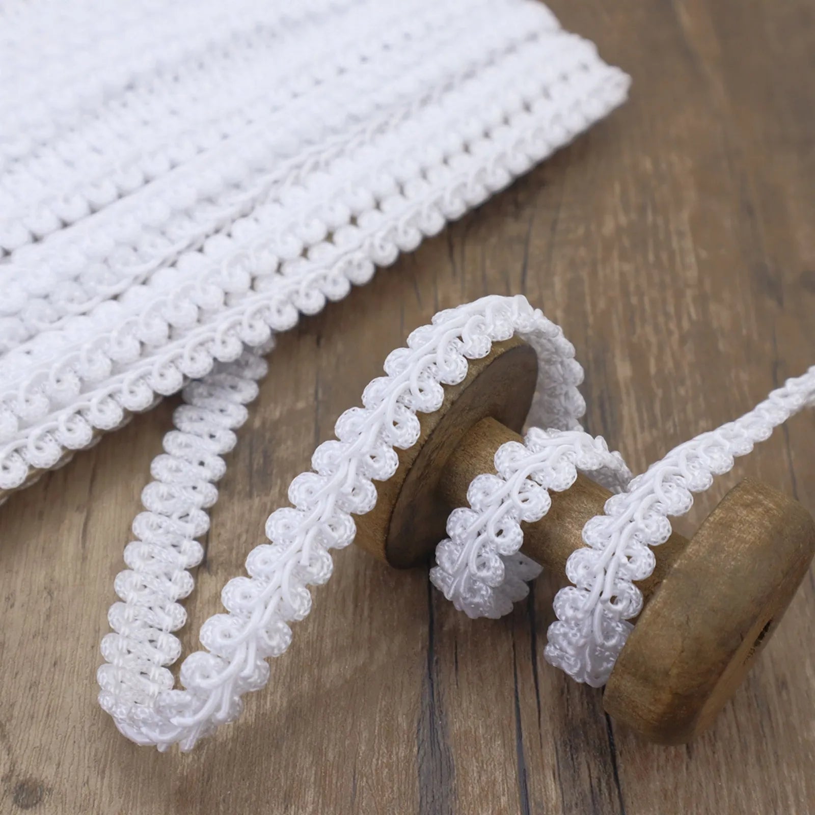 Close-up of the White Gimp Braid Trim showing its wavy texture, perfect for DIY crafts.

