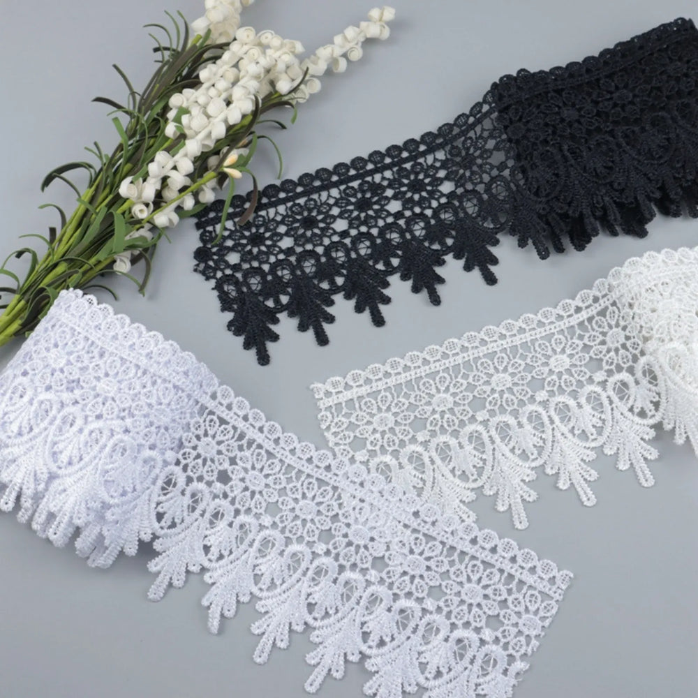 Venise floral embroidered lace trim color options displayed in a flat lay, featuring white, ivory, and black for multi-color SKU selection